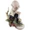 Винтажная статуэтка "Гном за починкой белья". Высота 14,5 см. Фарфор. Capodimonte, Италия, вторая половина 20 века. вид 2